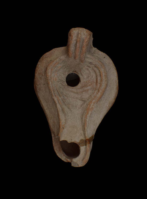 Lamp of Thracian type w biconical reservoir w fairly sharp carination; concave discus defined by 2 prominent ridges which continue, merging into 1, around outside of broad, elongated nozzle; in discus outline relief decoration: heart-shaped device pointing to nozzle w 3 curving relief lines below fill hole, loop on either side above fill hole; flat base recessed within crude raised band.  Uptilted thick, unperforated lug handle decorated w 2 deep grooves down the surface.  Unpainted.