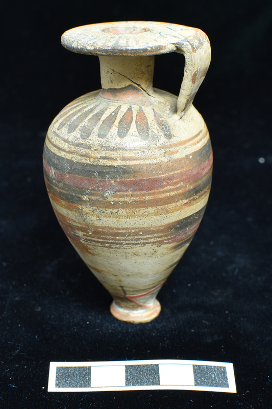 Piriform body decorated  w 2 broad dark stripes with added narrow red stripe on each & reserved band between & broad reserved band with central narrow stripe below; lower body & base totally coated; shoulder defined by 2 narrow stripes w pendant drops radiating from neck; 3 h stripes on handle, radiating stripes on surface of rim.