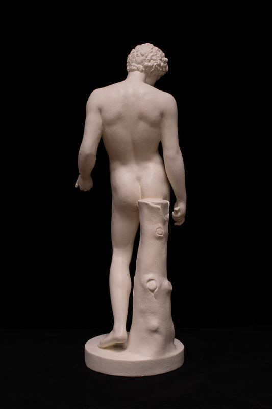 Miniature cast based on the co-called Capitoline Antinous, a Roman period statue of ca. AD 130-150 adapted from Greek models of the 4th c. BC. Found at Hadrian's Villa. Original held in the Capitoline Museum.  Left arm and left leg restored.