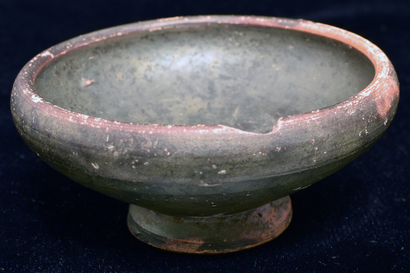 Bowl w shallowly convex sides rising fr thick ring base w deep conical underside to rounded shoulder & plain thick rim.  Int & most of ext coated w dark paint, most of underside of base uncoated. Firing ring visible on int.