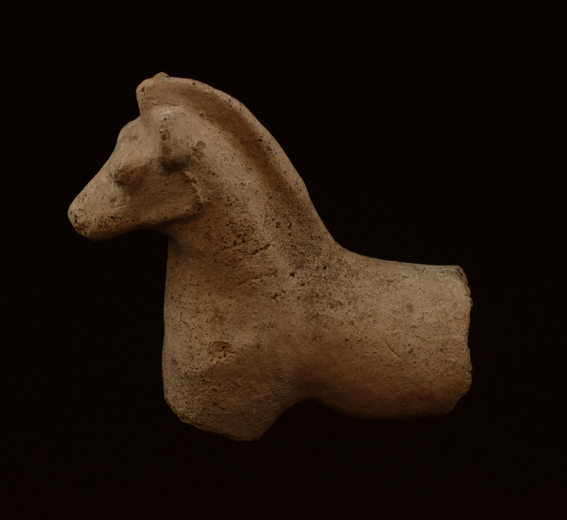 Mouldmade figure w nicely tapered muzzle; bulging eyes, raised ridge marking jawline, blunted ear & mane from forehead to top of back.