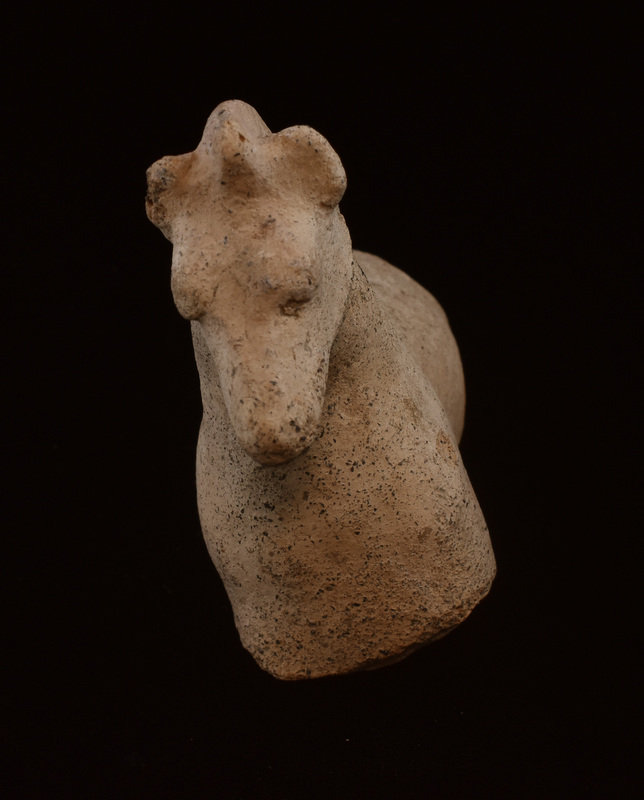 Mouldmade figure w nicely tapered muzzle; bulging eyes, raised ridge marking jawline, blunted ear & mane from forehead to top of back.