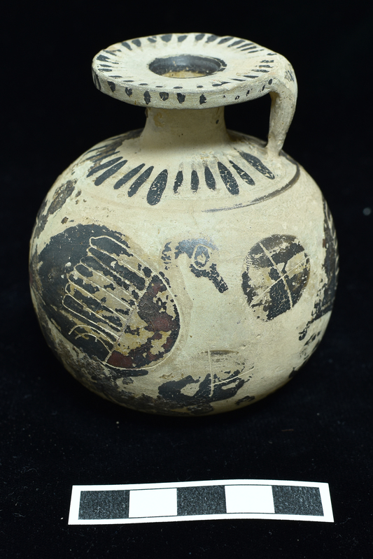 Round -bodied aryballos decorated with procession of 3 geese with decoration incised  and in added red ;  in field blob rosettes with cruciform incisions; base and shoulder decorated with radiating stripes separated from body by narrow horizontal stripe; edge and outer surface of rim decorated with radiating stripes; single stripe around mouth, 2 concentric stripes around solidly coated depression in base; 3 h stripes on back of handle.